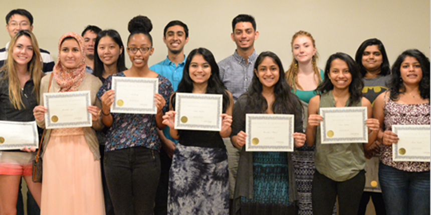 Students holding certificates